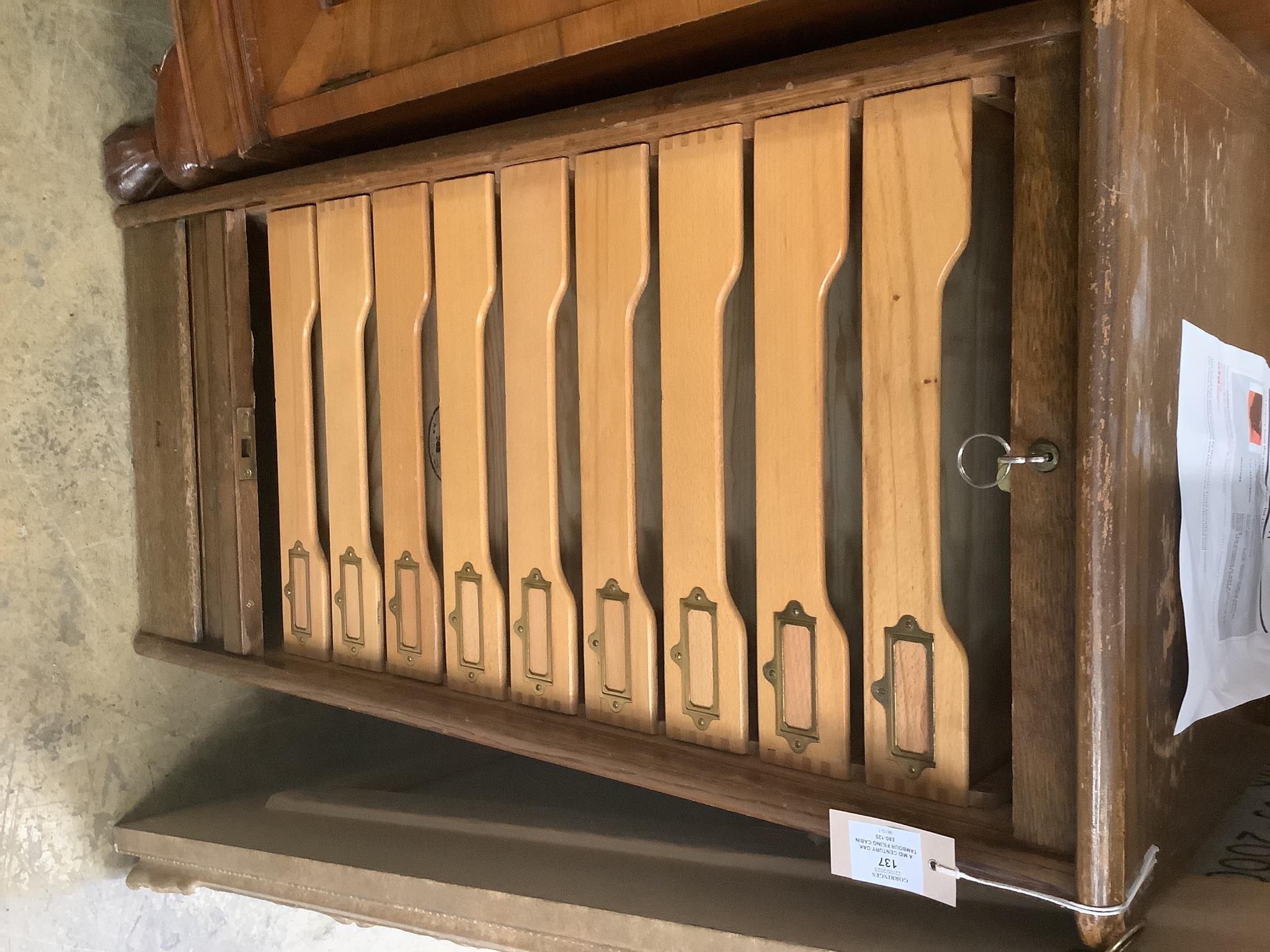 A mid century oak tambour filing cabinet, width 46cm, depth 40cm, height 93cm